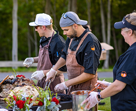 Line cooks at an outdoor dinner