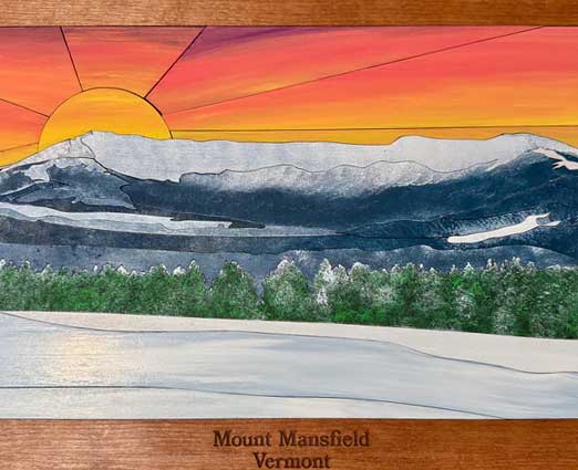 woman overlooking a hotel pool with fall mountains in the background