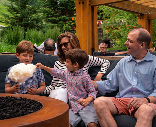 Family having fun eating cotton candy