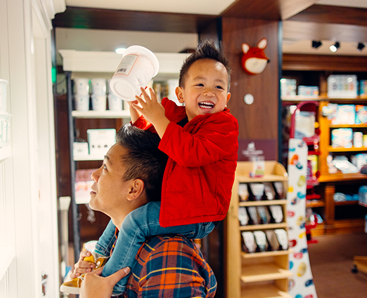 Kid shopping for candy with his father