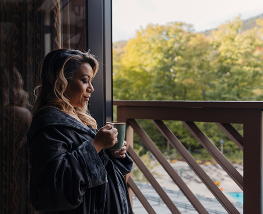 Woman relaxing with a cup of coffee in the spa