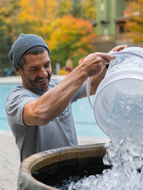 Man Filling Tub with Ice